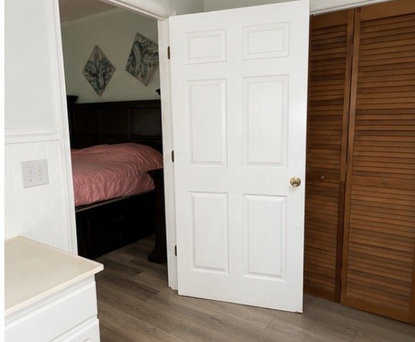 Bedroom doorway and closet doors